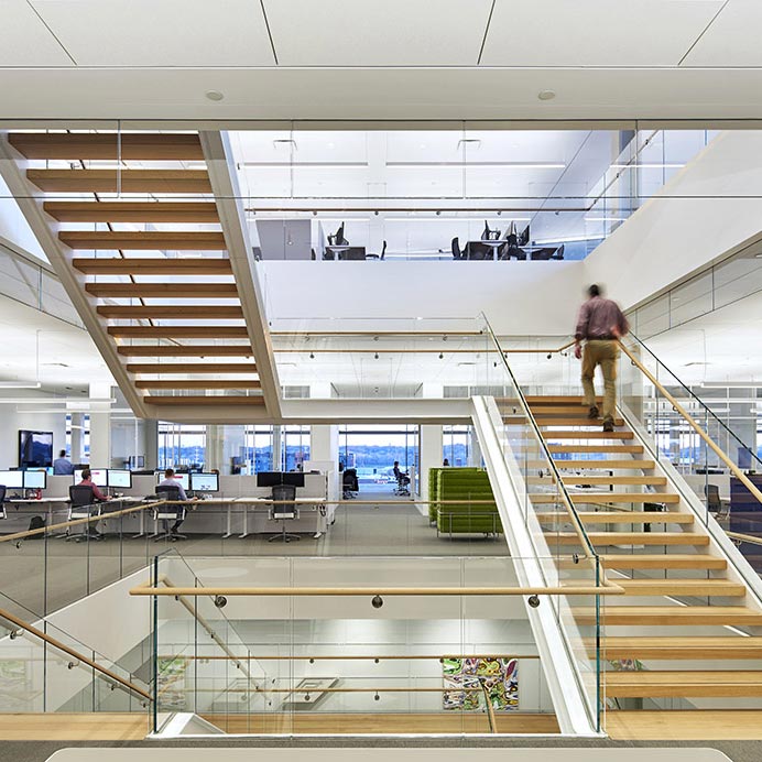 Man Walking up Work Staircase